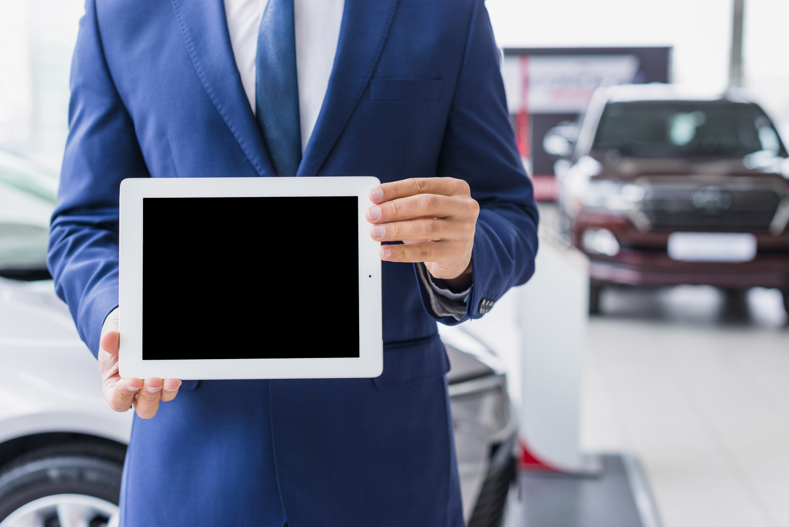 car-salesman-with-tablet